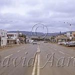 10th street with Bill's News visible 1969.  Image has been cropped and blurred for the internet